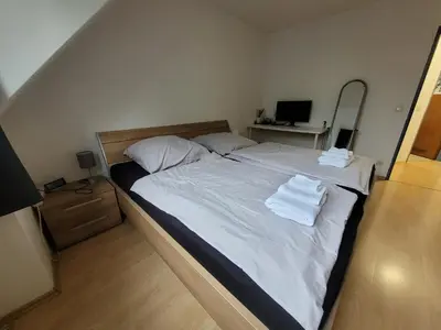 Ein Bett oder Betten in einem Zimmer der Unterkunft Zentrale 2 Zimmer-Wohnung mit Balkon