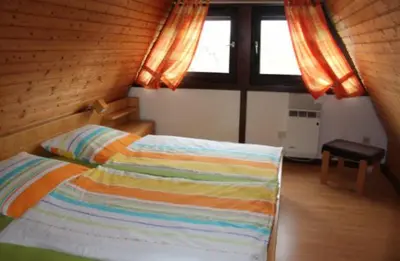 Ein Bett oder Betten in einem Zimmer der Unterkunft Ferienhaus Maria