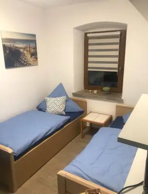 Ein Bett oder Betten in einem Zimmer der Unterkunft Zum Gogerer