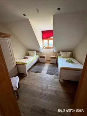 Ein Bett oder Betten in einem Zimmer der Unterkunft Ferienhaus Anton