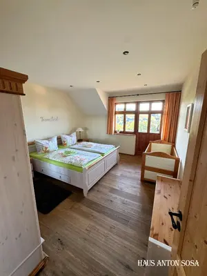 Ein Bett oder Betten in einem Zimmer der Unterkunft Ferienhaus Anton