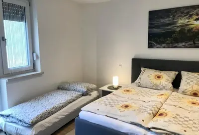 Ein Bett oder Betten in einem Zimmer der Unterkunft Ferienwohnung Altstadtherz