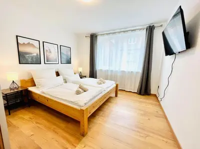 Ein Bett oder Betten in einem Zimmer der Unterkunft FRÜHLINGSAKTION Moderne 2-Zimmer Wohnung im Stadtzentrum mit Parkplatz
