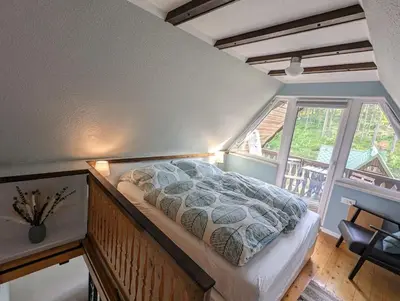 Ein Bett oder Betten in einem Zimmer der Unterkunft Romantisches Rückzugsnest - Waldidylle und Bergblick