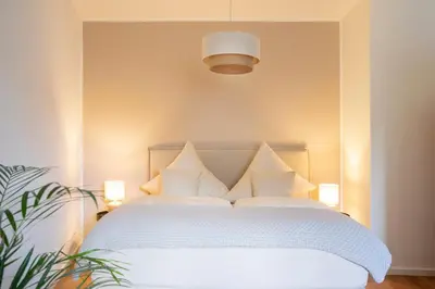 Ein Bett oder Betten in einem Zimmer der Unterkunft bayreuthome - Geschmackvoll und ruhig gelegen - 2 Schlafzimmer