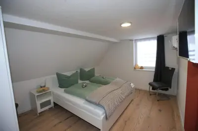 Ein Bett oder Betten in einem Zimmer der Unterkunft Ferienhaus am Erbgericht Oberjugel