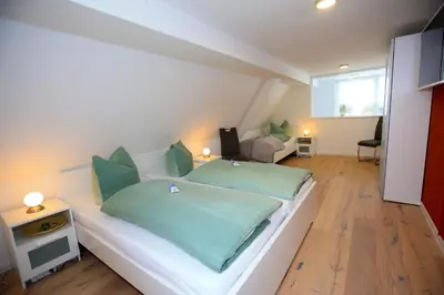 Ein Bett oder Betten in einem Zimmer der Unterkunft Ferienhaus am Erbgericht Oberjugel
