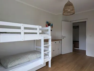 Ein Bett oder Betten in einem Zimmer der Unterkunft FeWo Bergsonne - 2 Schlafzimmer, modern, Familie, ruhige Lage