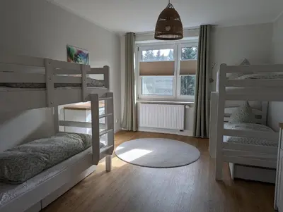 Ein Bett oder Betten in einem Zimmer der Unterkunft FeWo Bergsonne - 2 Schlafzimmer, modern, Familie, ruhige Lage