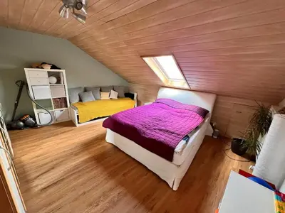 Ein Bett oder Betten in einem Zimmer der Unterkunft Ferienwohnung Spitzenberger
