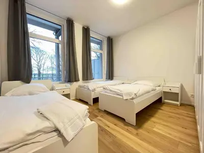 Ein Bett oder Betten in einem Zimmer der Unterkunft AM1056 - Moderne Monteur oder Ferienwohnung