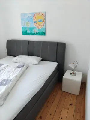 Ein Bett oder Betten in einem Zimmer der Unterkunft Ferienwohnung Linde bei Ferienwohnungen May