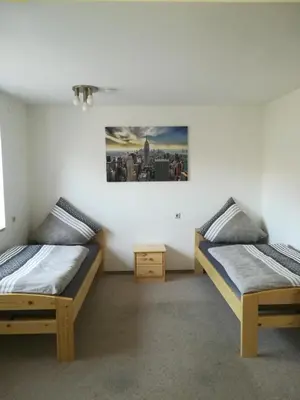 Ein Bett oder Betten in einem Zimmer der Unterkunft Wohnung-Haus für Arbeiter und Monteure bis 11 Personen Amberg
