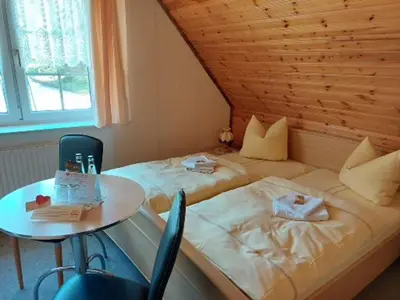 Ein Bett oder Betten in einem Zimmer der Unterkunft Gasthaus Talsperre -Gaststätte und Pension-