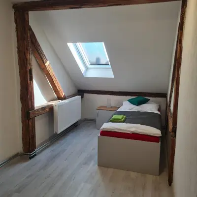 Ein Bett oder Betten in einem Zimmer der Unterkunft Hauptmann5