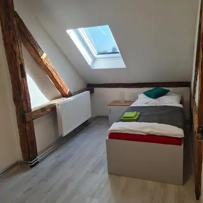 Ein Bett oder Betten in einem Zimmer der Unterkunft Hauptmann5