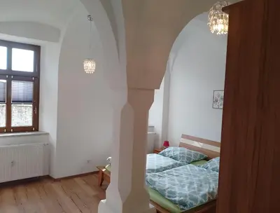 Ein Bett oder Betten in einem Zimmer der Unterkunft Ferienwohnung im Rittergut Plohn 500 meter zum Freizeitpark