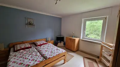 Ein Bett oder Betten in einem Zimmer der Unterkunft Altes Zollhaus im Wald