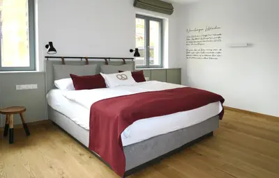 Ein Bett oder Betten in einem Zimmer der Unterkunft Gästehaus Gräf Haus
