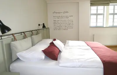 Ein Bett oder Betten in einem Zimmer der Unterkunft Gästehaus Gräf Haus