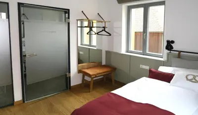 Ein Bett oder Betten in einem Zimmer der Unterkunft Gästehaus Gräf Haus