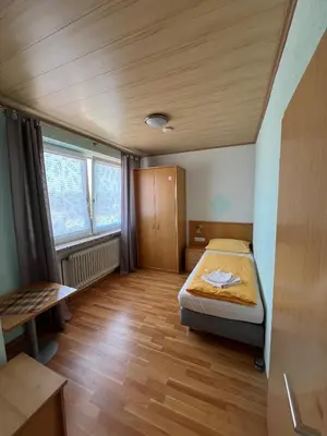 Ein Bett oder Betten in einem Zimmer der Unterkunft Gasthaus & Metzgerei Besenhardt