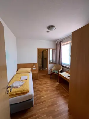 Ein Bett oder Betten in einem Zimmer der Unterkunft Gasthaus & Metzgerei Besenhardt