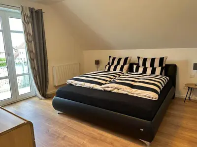 Ein Bett oder Betten in einem Zimmer der Unterkunft Neuwertige gemütliche Wohnung