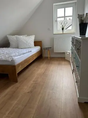 Ein Bett oder Betten in einem Zimmer der Unterkunft Neuwertige gemütliche Wohnung