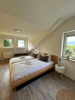 Ein Bett oder Betten in einem Zimmer der Unterkunft Apartment Kornbergblick
