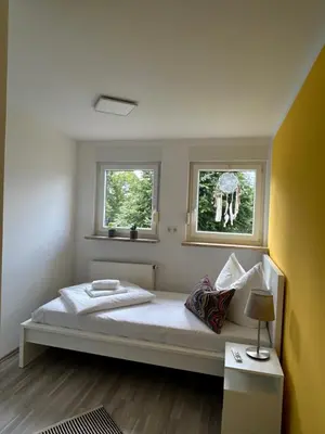 Ein Bett oder Betten in einem Zimmer der Unterkunft Apartment Kornbergblick
