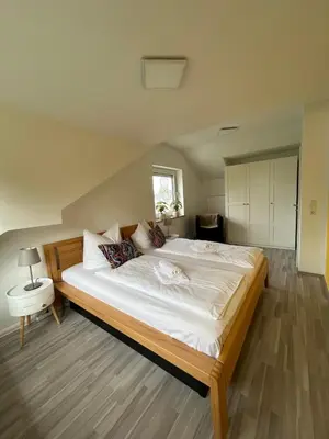 Ein Bett oder Betten in einem Zimmer der Unterkunft Apartment Kornbergblick