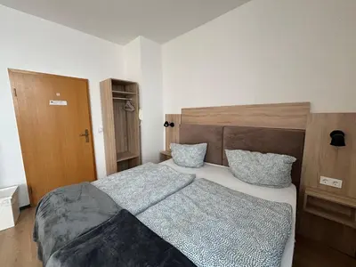 Ein Bett oder Betten in einem Zimmer der Unterkunft Deutscher Hof