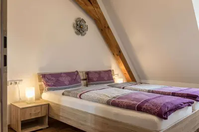 Ein Bett oder Betten in einem Zimmer der Unterkunft Ferienwohnung Zetzl