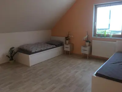 Ein Bett oder Betten in einem Zimmer der Unterkunft Haus mit Terrasse am Sonnenuntergang