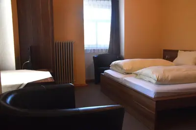 Ein Bett oder Betten in einem Zimmer der Unterkunft Scheffel - Gasthof