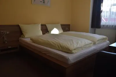 Ein Bett oder Betten in einem Zimmer der Unterkunft Scheffel - Gasthof