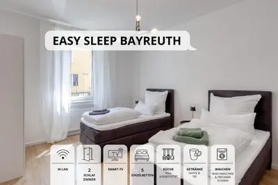 Ein Bett oder Betten in einem Zimmer der Unterkunft Sali Homes - 3BR Apartment, 6 Single Beds, Central Bayreuth