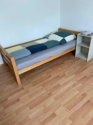 Ein Bett oder Betten in einem Zimmer der Unterkunft NEU Ferienwohnungen im Naherholungs u Seengebiet