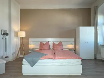 Ein Bett oder Betten in einem Zimmer der Unterkunft Ferienwohnung Plohn by Immo-Franzi