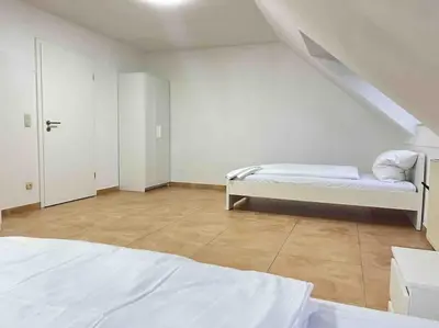Ein Bett oder Betten in einem Zimmer der Unterkunft SWF112 - Gemütliche Monteurwohnung Übergangswohnung