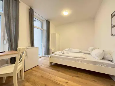 Ein Bett oder Betten in einem Zimmer der Unterkunft AM1026 - Smarte Monteurwohnung Übergangswohnung