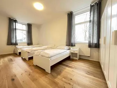 Ein Bett oder Betten in einem Zimmer der Unterkunft AM1036 - Moderne Monteurwohnung mit Balkon