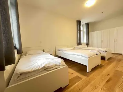 Ein Bett oder Betten in einem Zimmer der Unterkunft AM1036 - Moderne Monteurwohnung mit Balkon