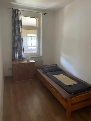 Ein Bett oder Betten in einem Zimmer der Unterkunft Ferienwohnung Goldener Drache