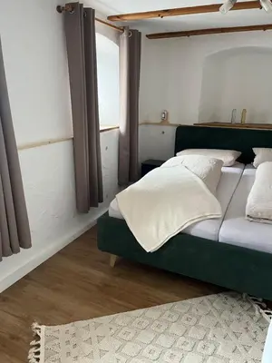 Ein Bett oder Betten in einem Zimmer der Unterkunft Der Grandlhof - Ferien am Hof