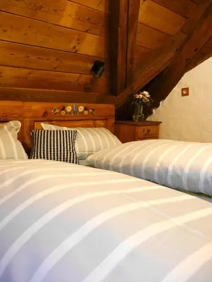 Ein Bett oder Betten in einem Zimmer der Unterkunft Der Grandlhof - Ferien am Hof