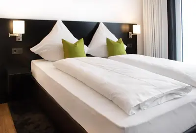 Ein Bett oder Betten in einem Zimmer der Unterkunft MSG Hotel by WMM Hotels