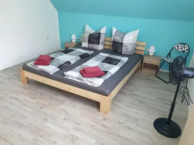 Ein Bett oder Betten in einem Zimmer der Unterkunft Großzügige Ferienwohnung