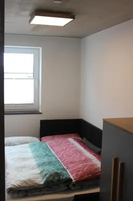 Ein Bett oder Betten in einem Zimmer der Unterkunft Apartments Patzina NEU 2024 - Kurort Oberwiesenthal